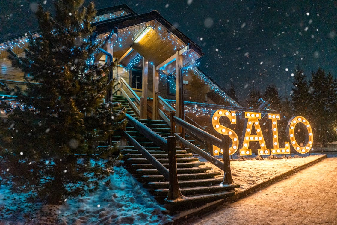 Home with permanent LED exterior lighting glowing at night