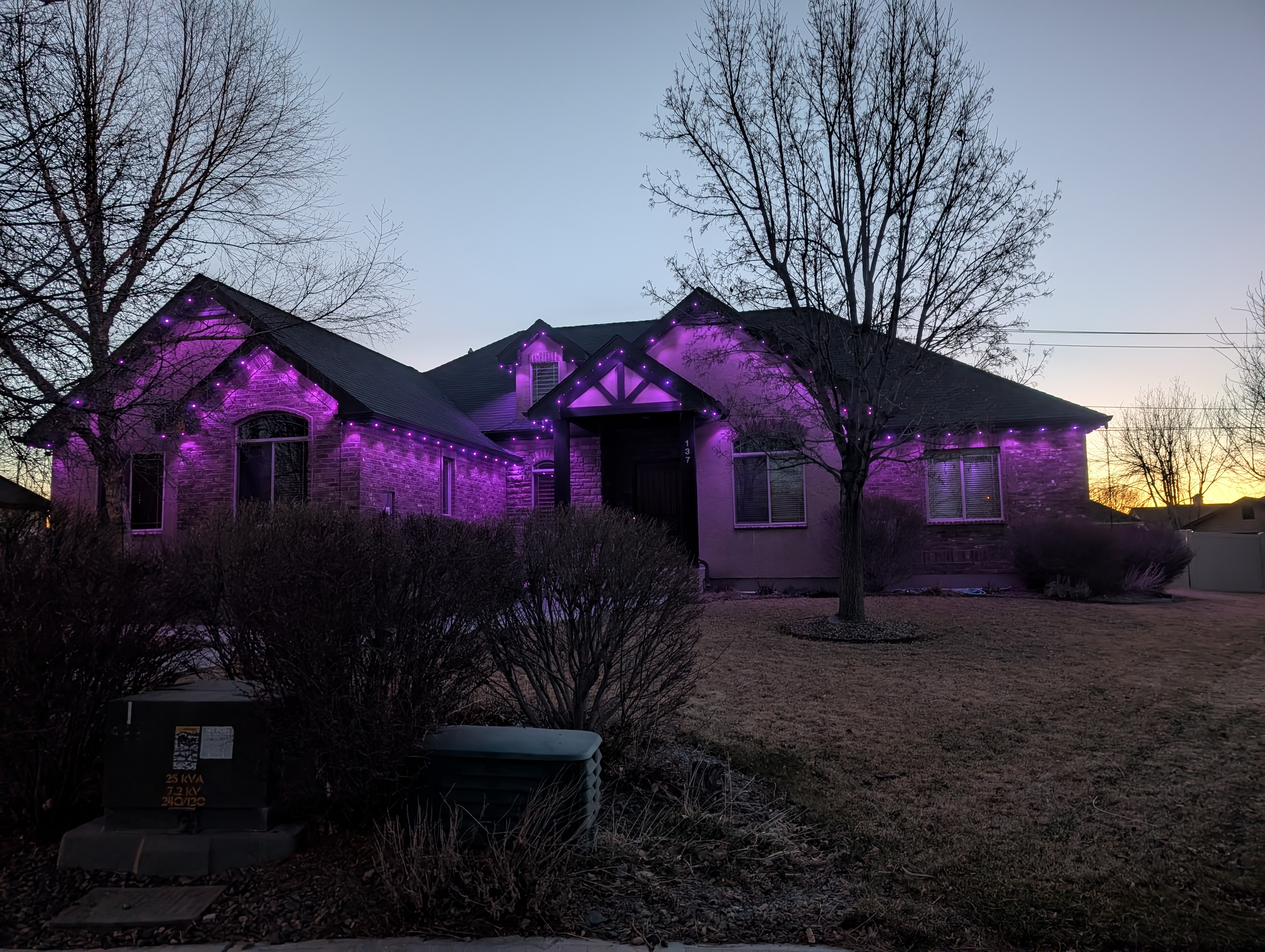 Home glowing in purple permanent LED lighting
