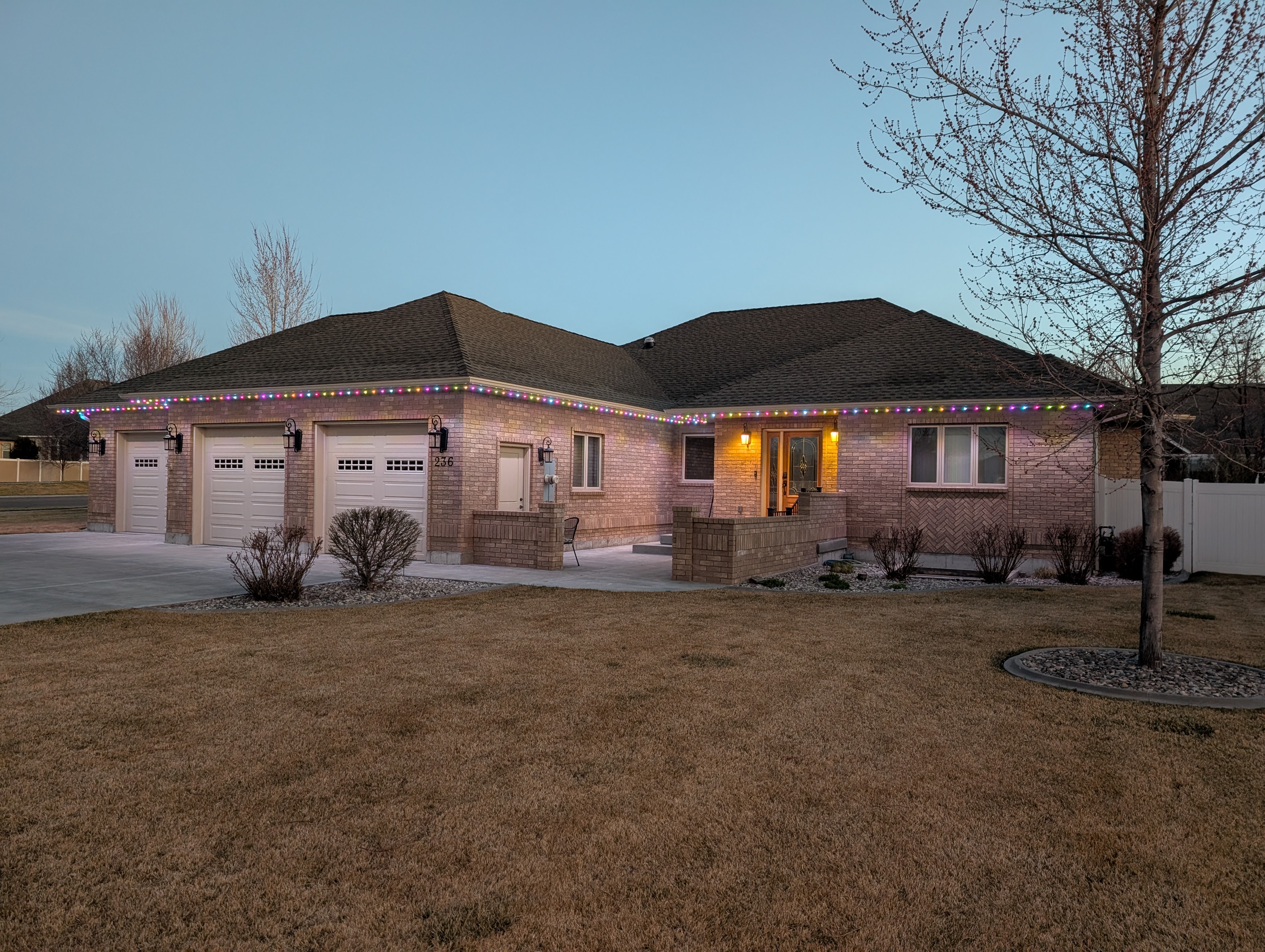 Large ranch home with permanent LED roofline lighting
