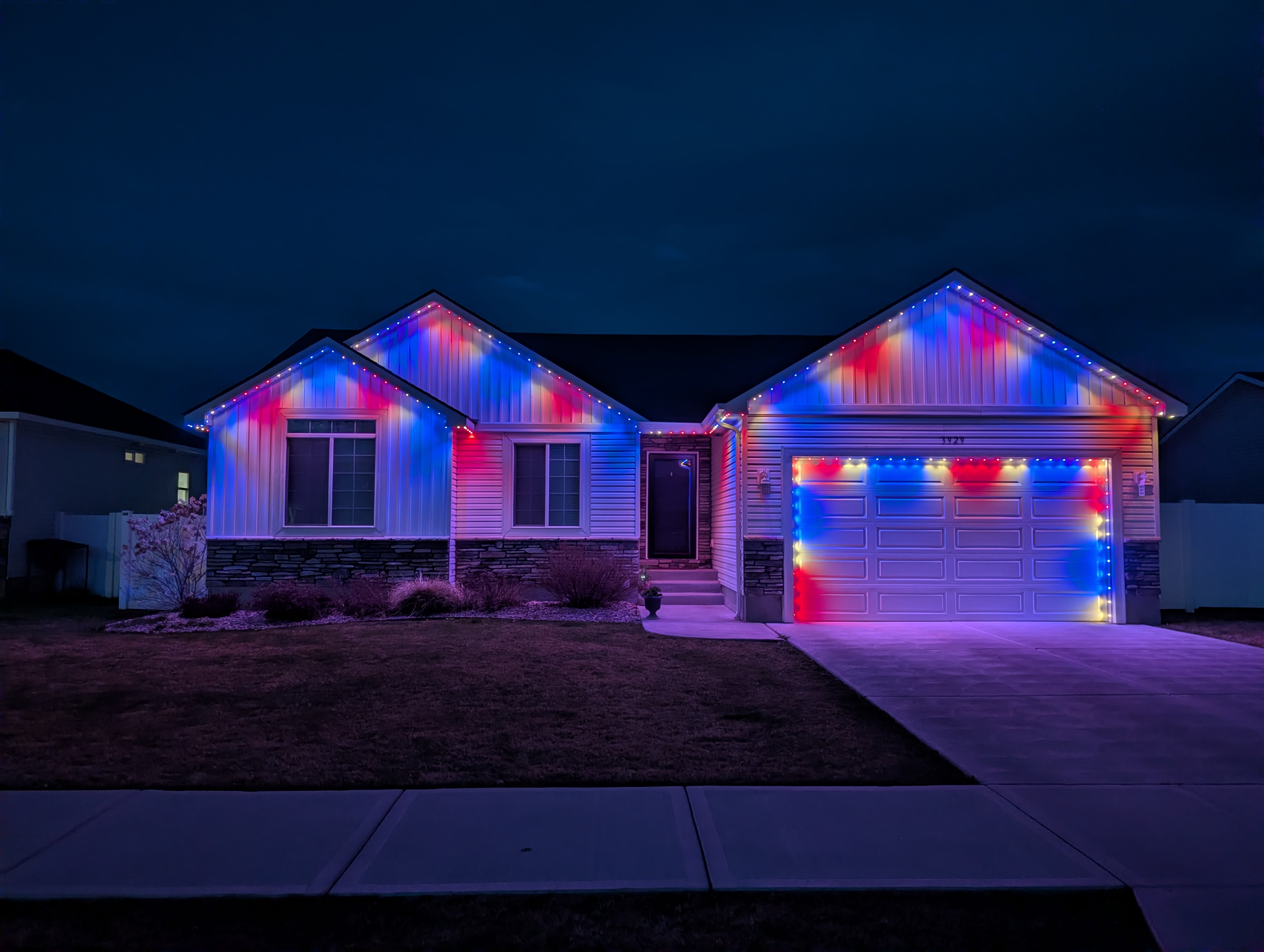 Home with red, white and blue permanent LED lighting for the Fourth of July
